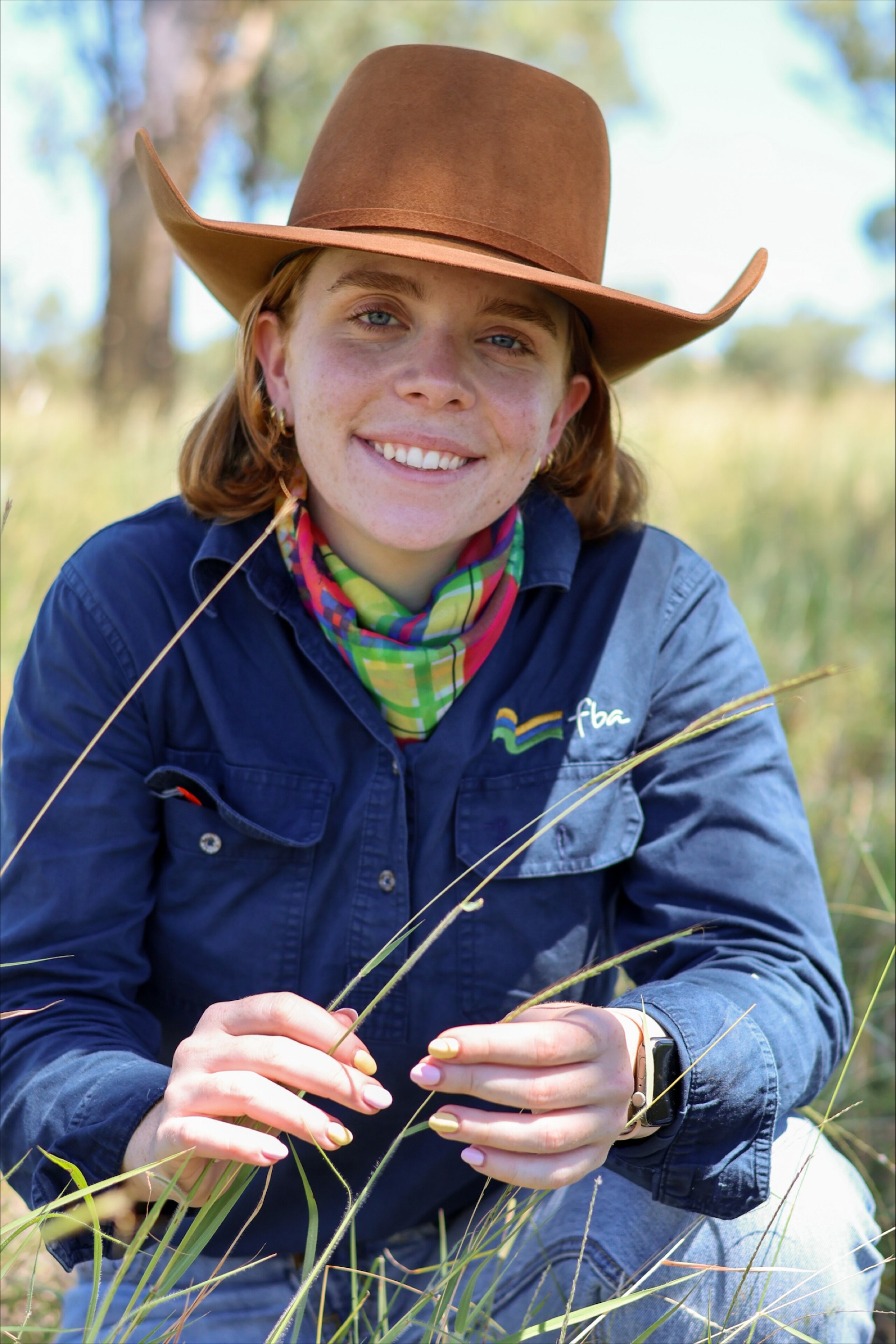 Grace Wickson FBA Land management officer with king blue grass