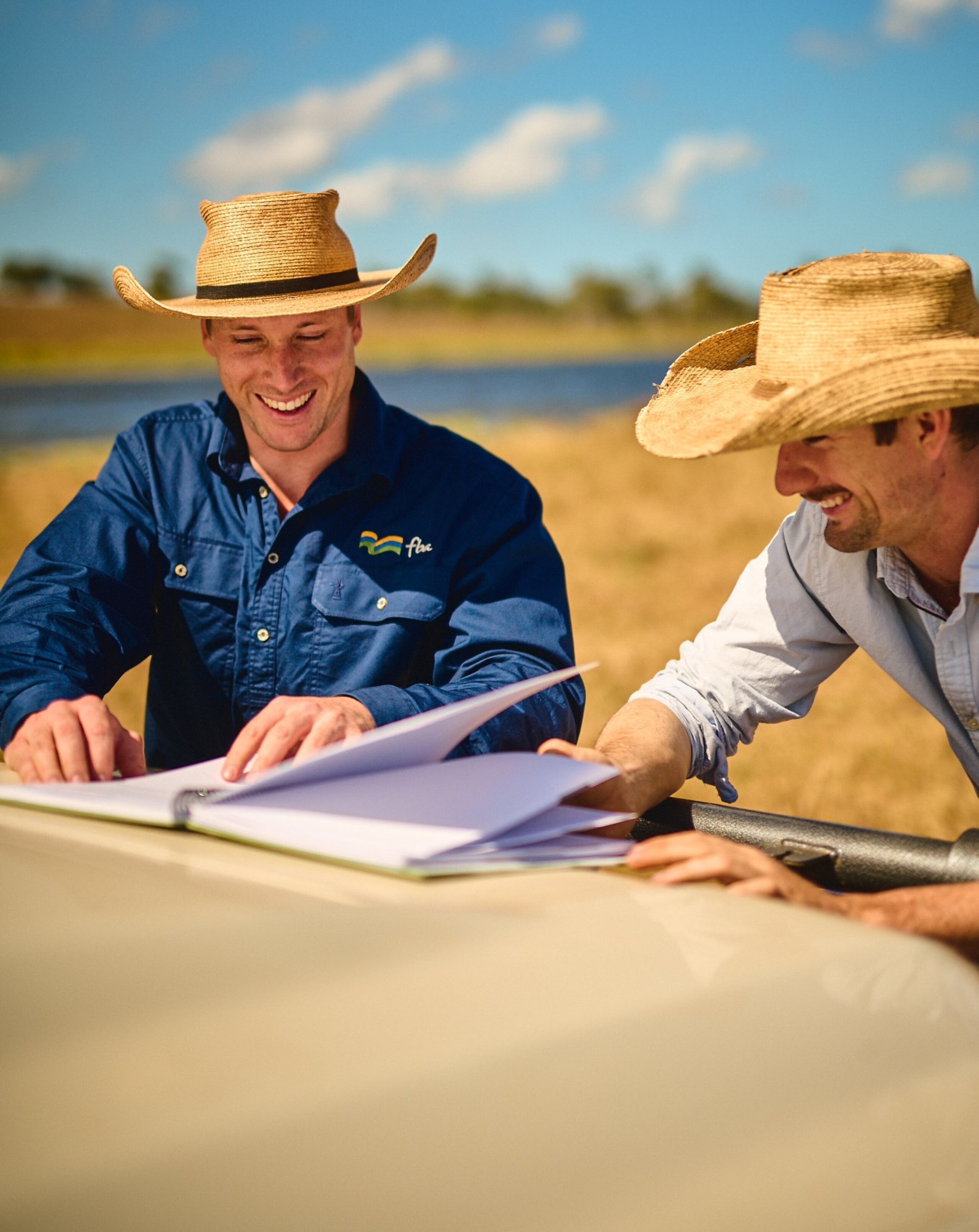 Two men looking through documents