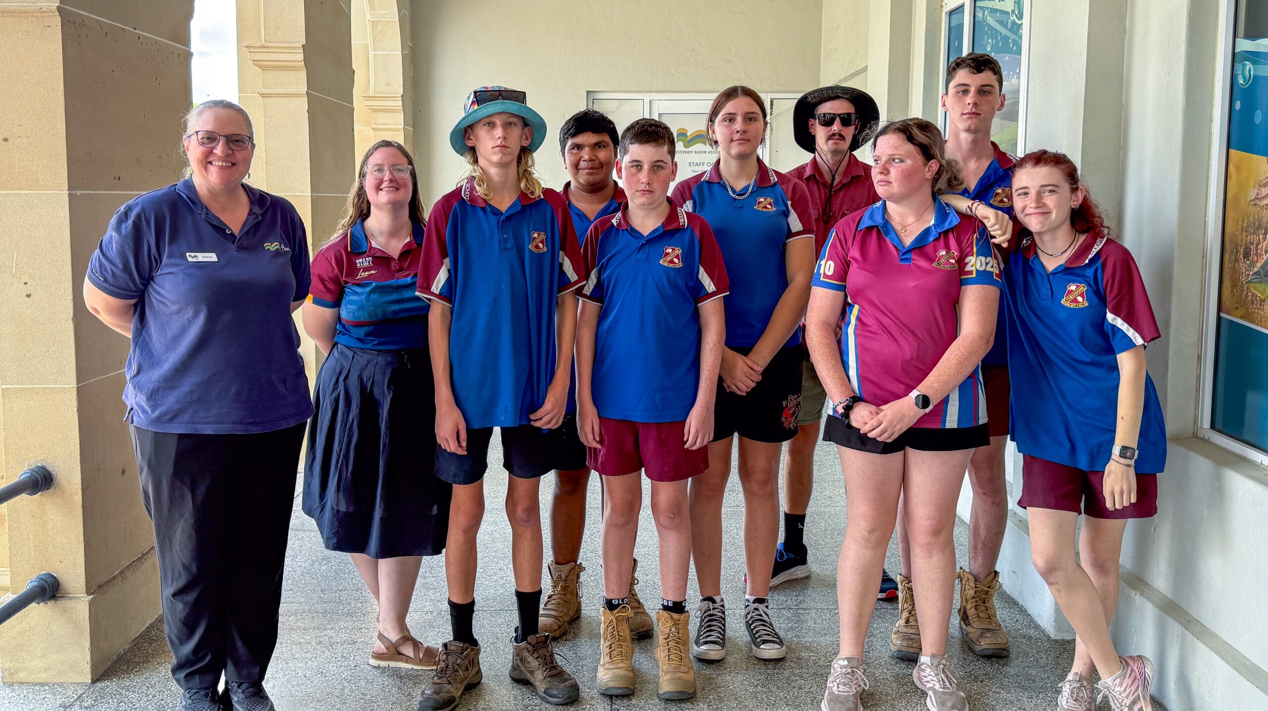 Group photo of an FBA staff member together Theodore State School students