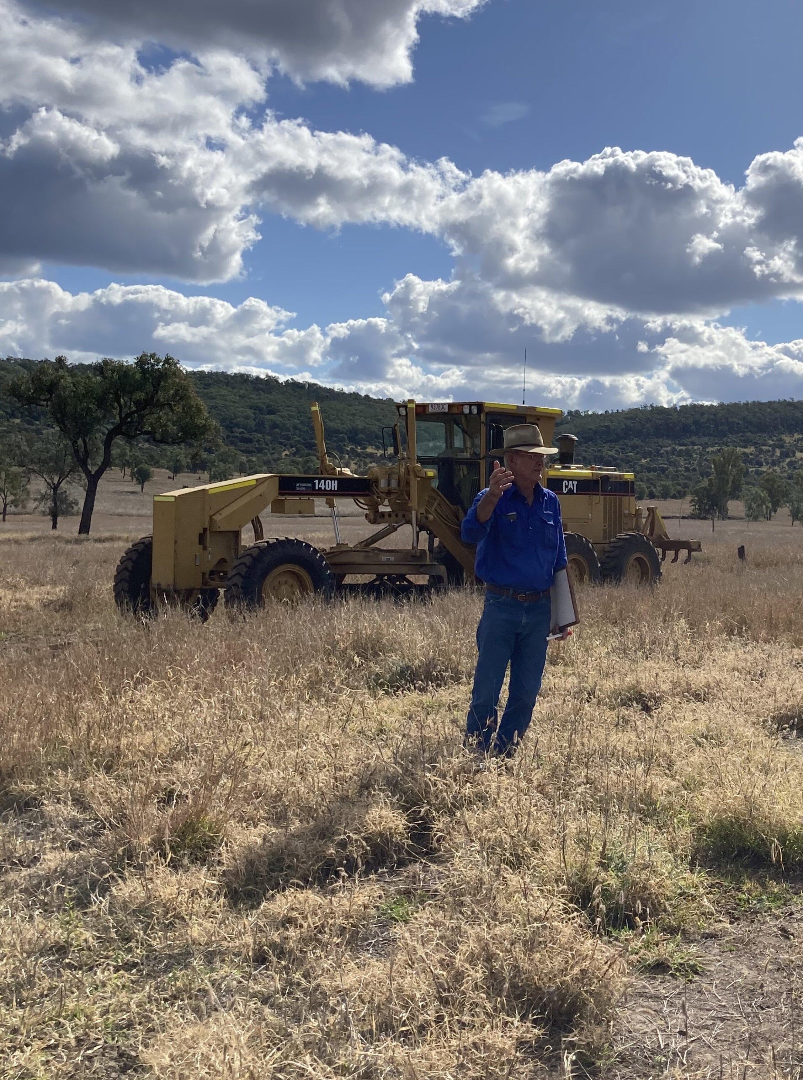 Darryl Field standing in a field during a workshop