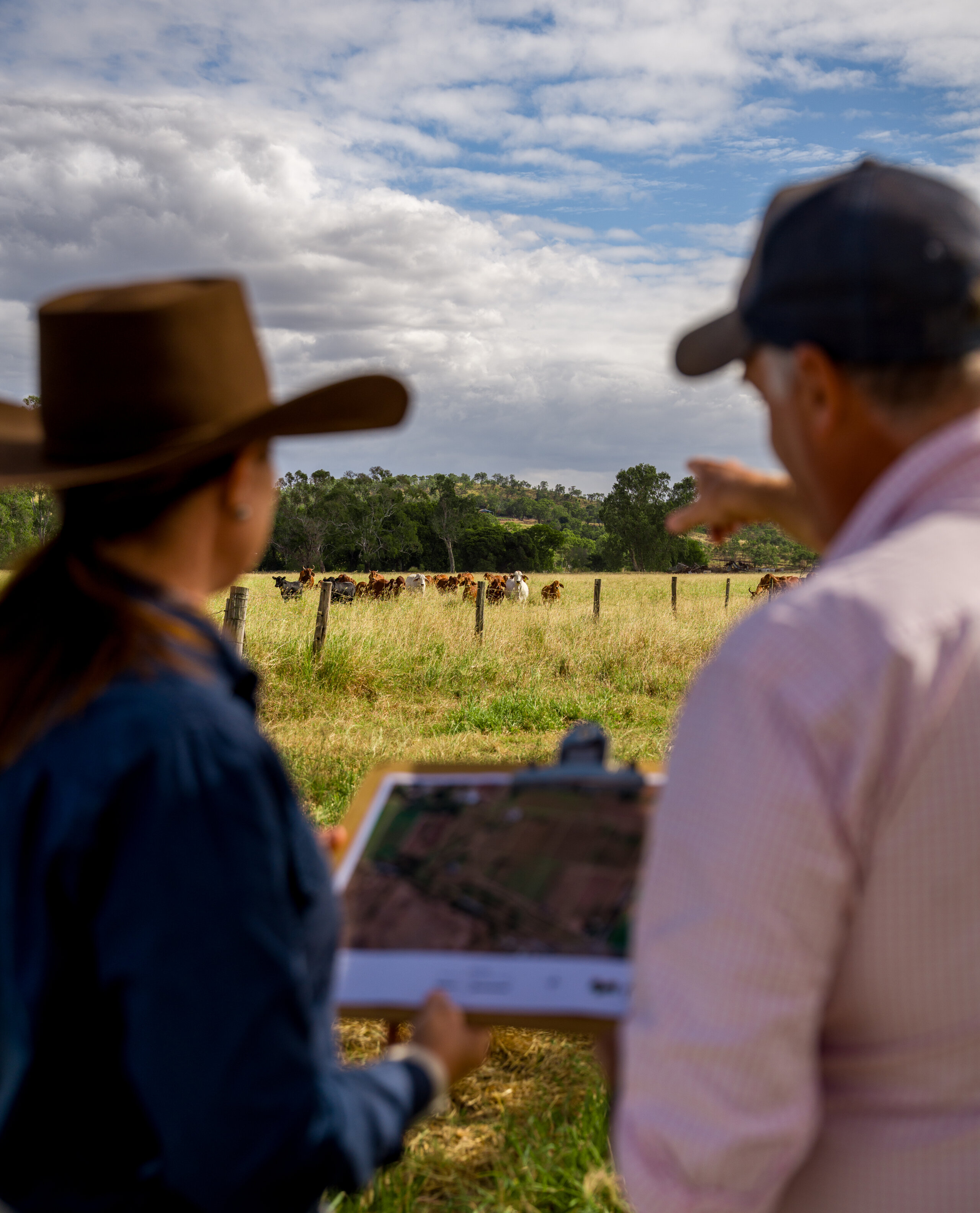 An FBA staff member talking about land management solutions with a CQ land manager
