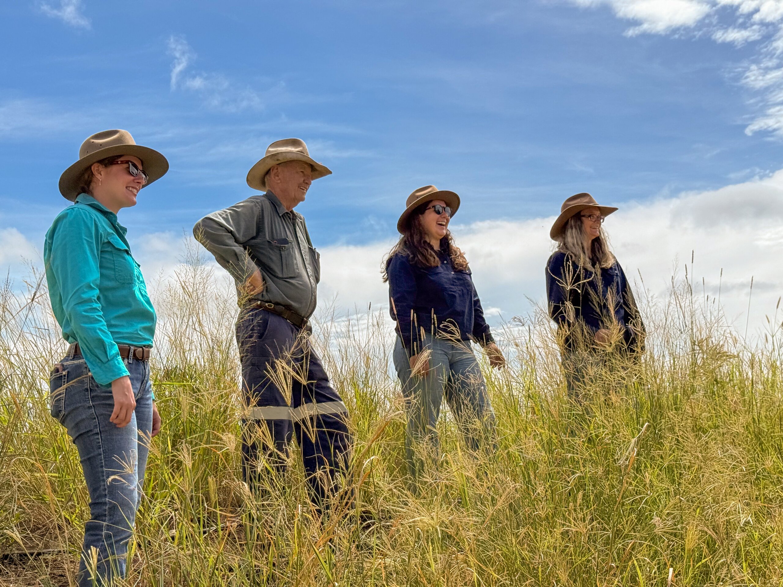 FBA staff members and a land manager standing in a field