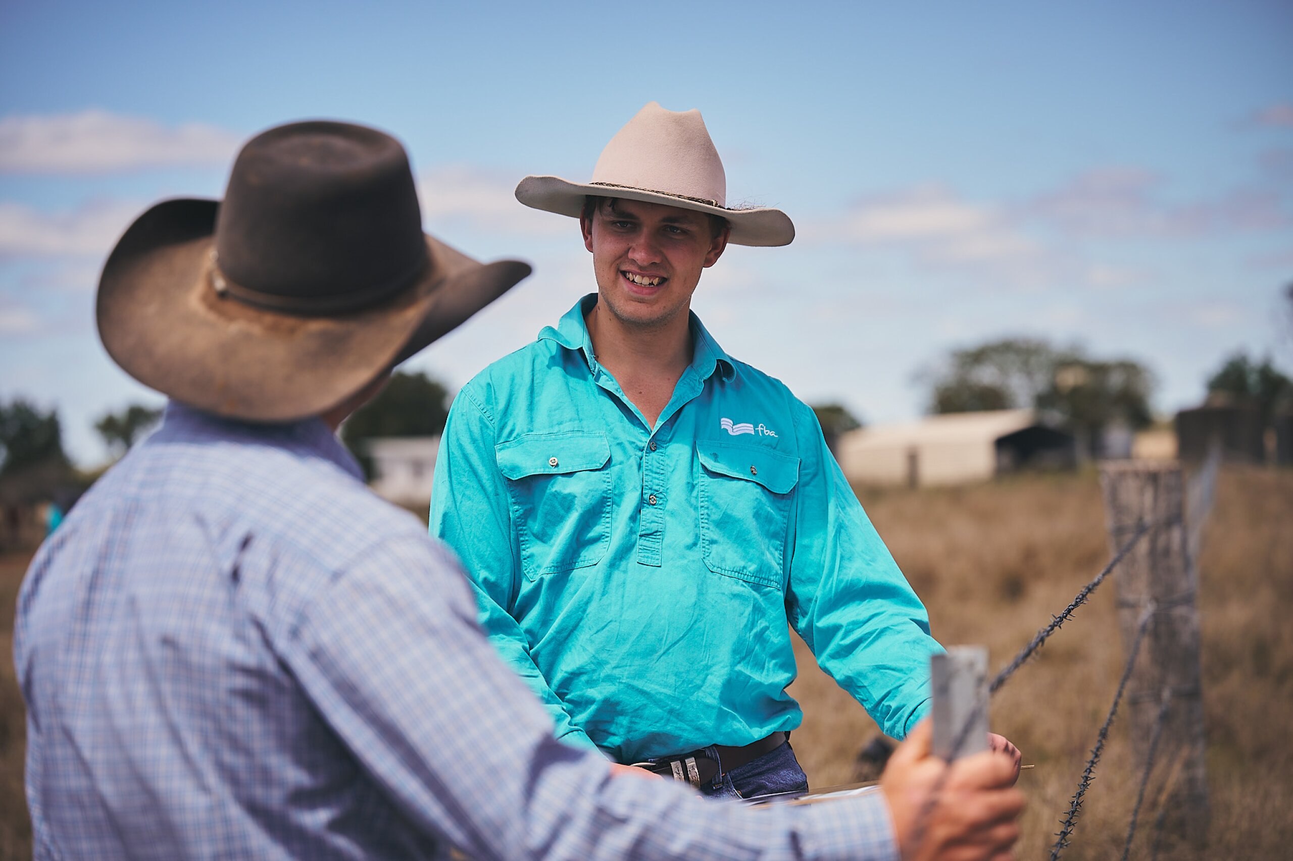 An FBA staff member is talking to a land manager during a property visit