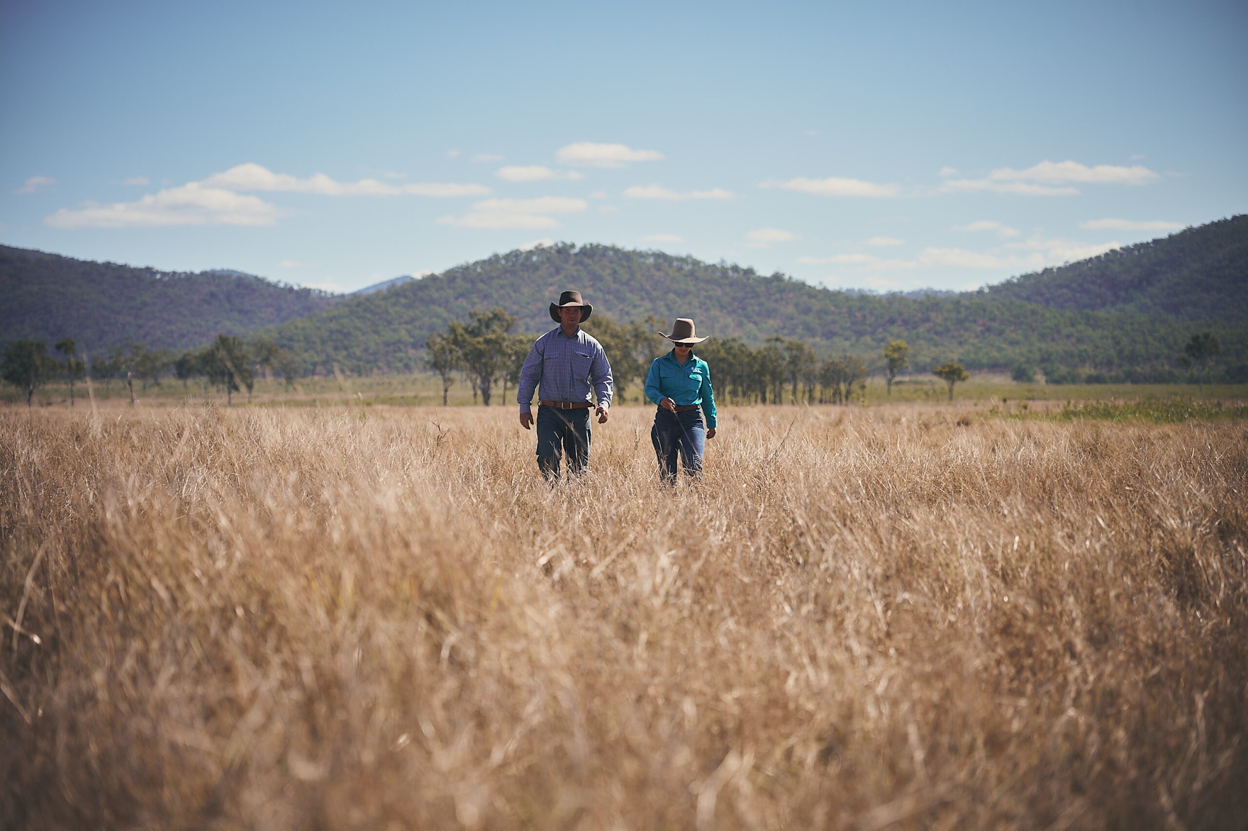 A land manager and an FBA staff member walk through a paddock.
