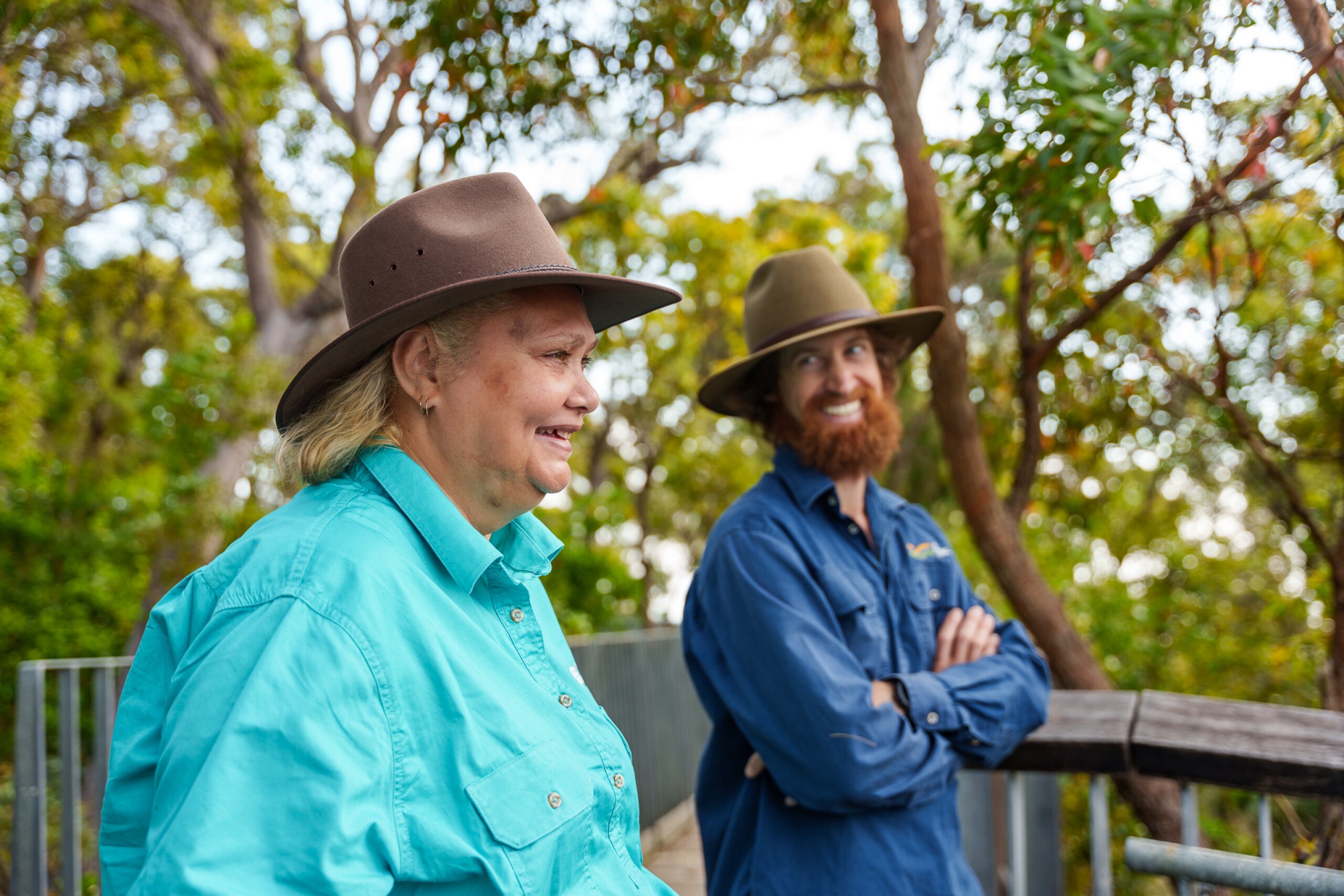 Two FBA staff smile while talking