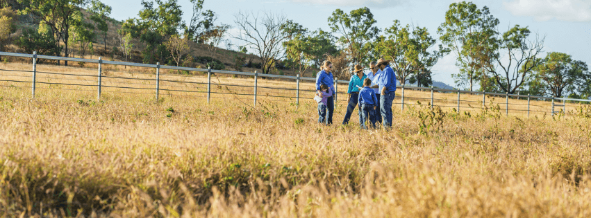  a land manager evaluating a property with the owners